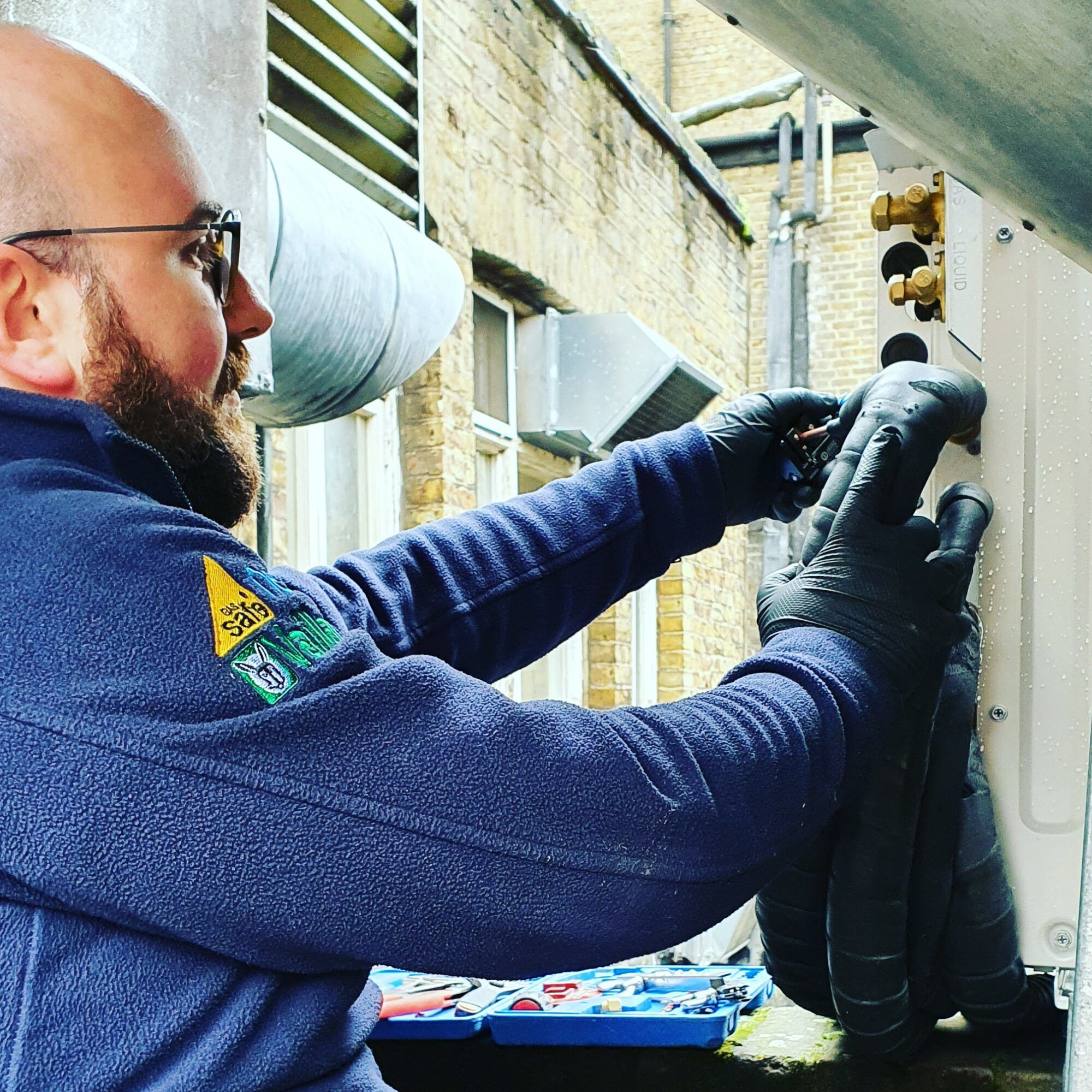 Image with Masper Engineers F-gas qualified installing a new multi split air conditioning condenser unit for a business in Westminster