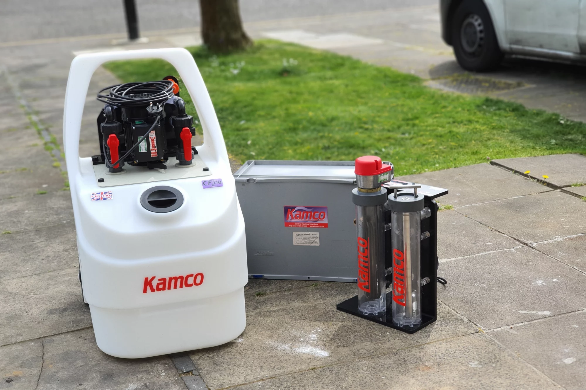 CF210 powerflush machine set up on an outdoor driveway, ready for a heating system powerflush service.